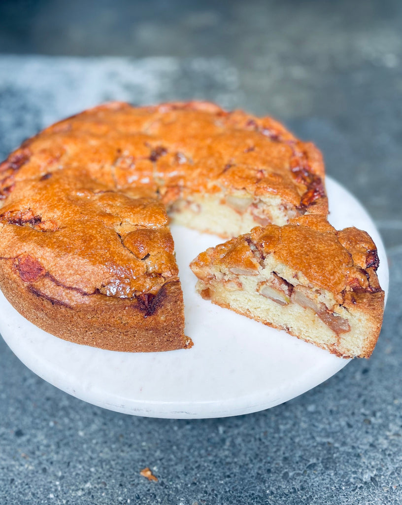 photo of a sliced apple cake with a honey glaze