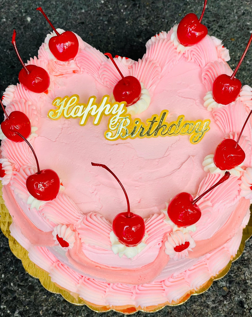 heart shaped cake with Happy Birthday plaque