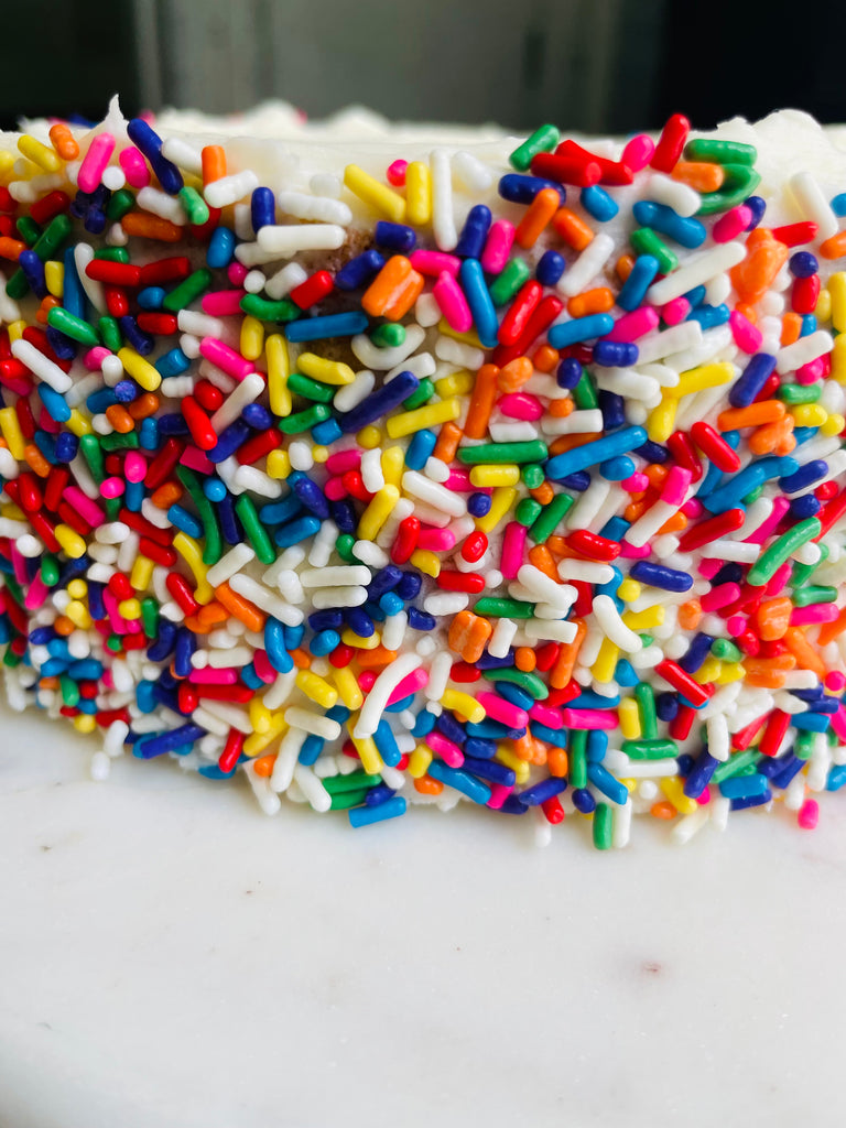 close up photo of vanilla confetti layer cake