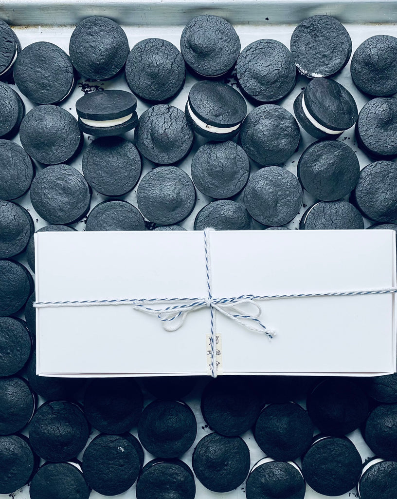 photo of a gift box on top of a tray of oreos.