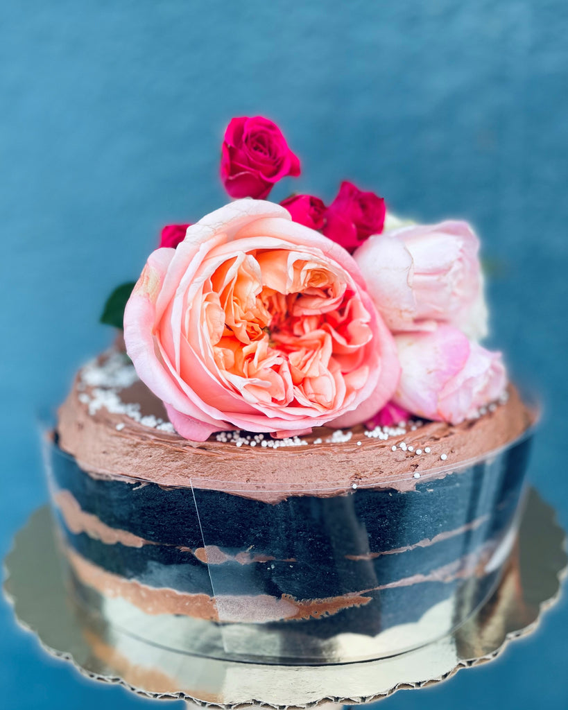 old fashioned chocolate cake topped with fresh fllowers