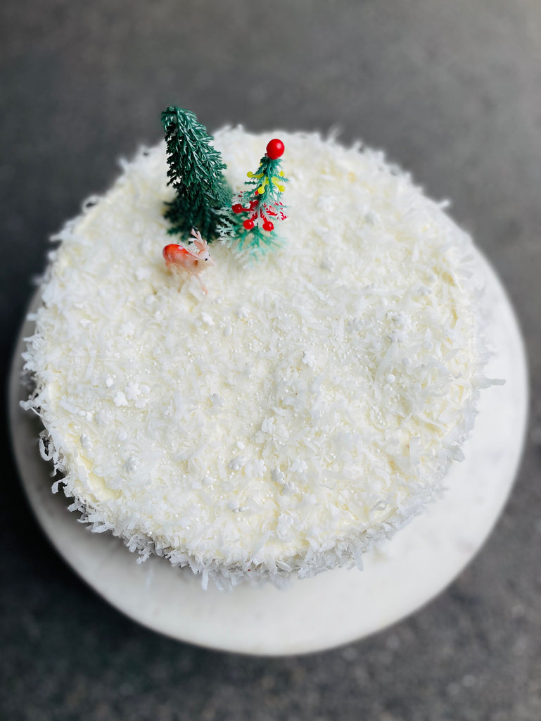 Coconut Layer cake topped with vintage plastic trees