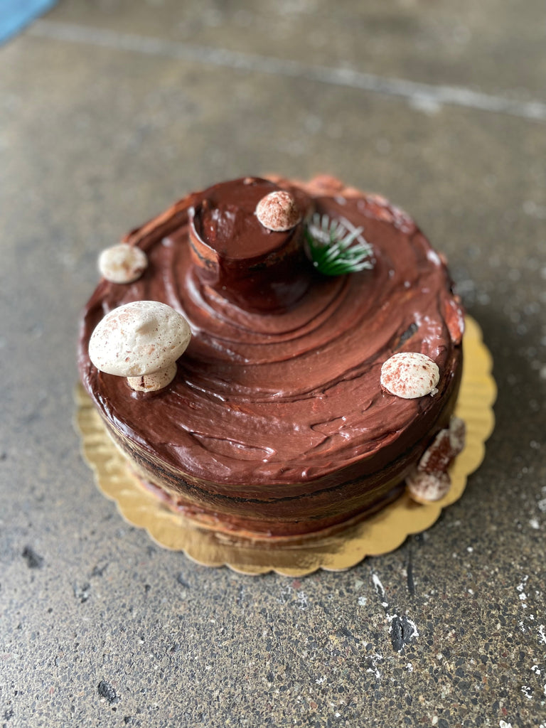 Chocolate Yule Stump, chocolate cake with meringue and buttercream mushrooms.